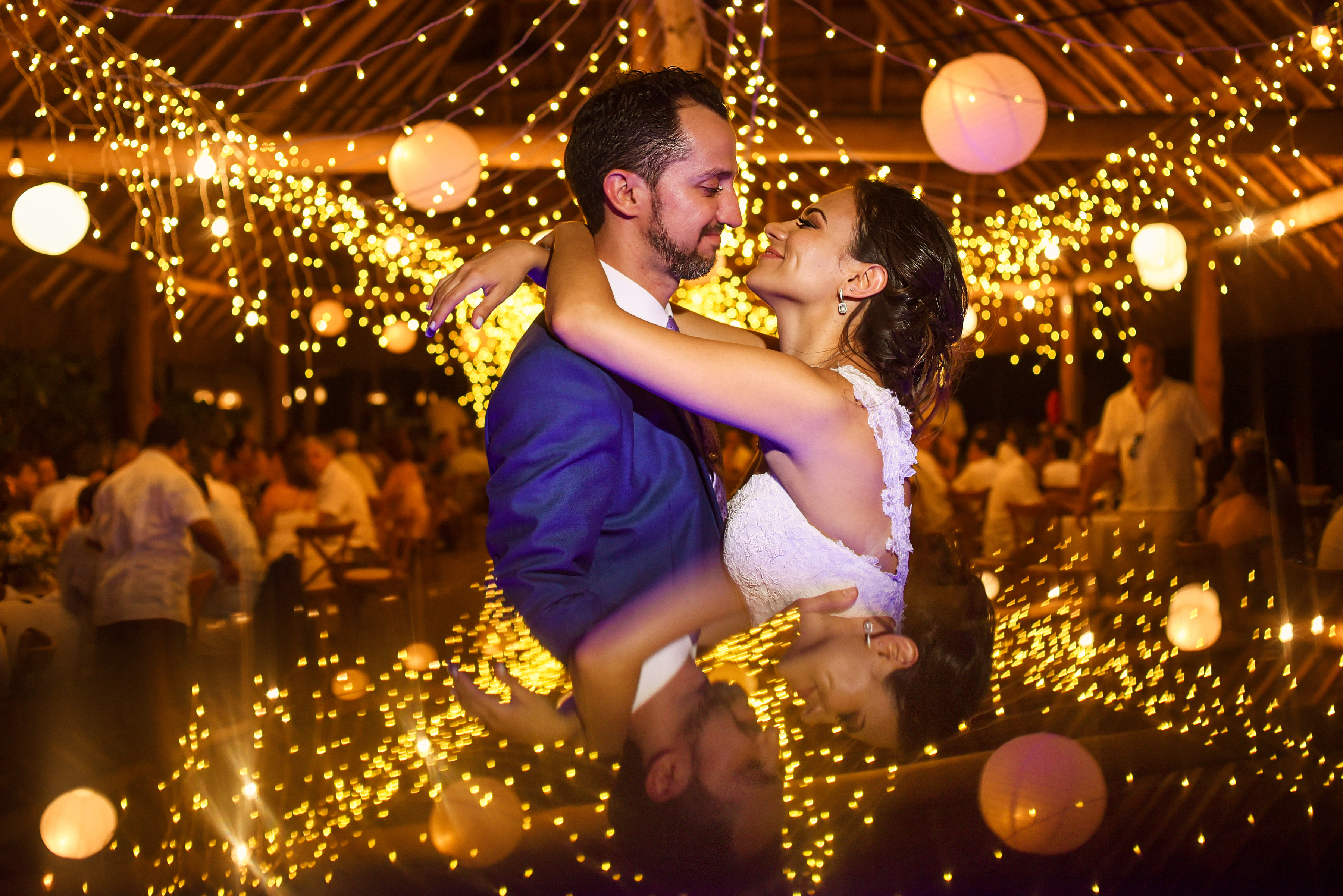 Bride and groom first dance shot with string lights at Blue Venado Beach Club, Mexico. Martina Campolo Riviera Maya Wedding Photography