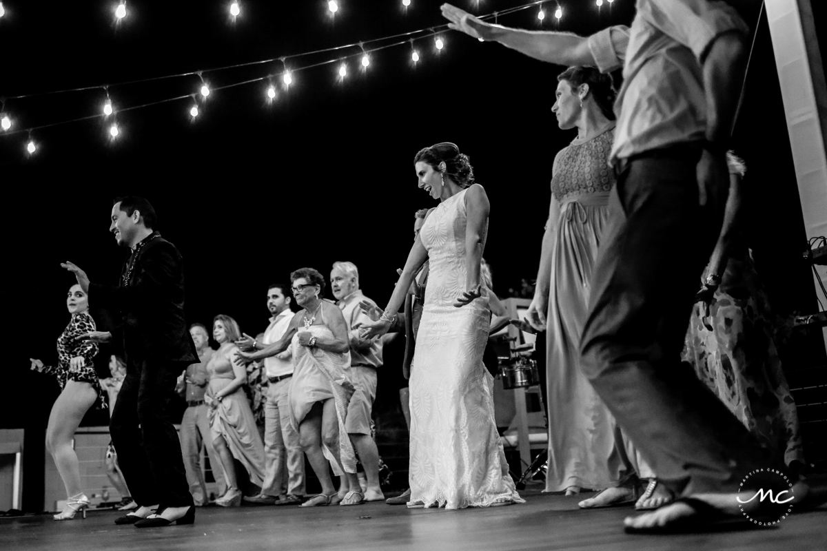 Bride and wedding guests dance at Blue Diamond Luxury Boutique Hotel. Martina Campolo Photography