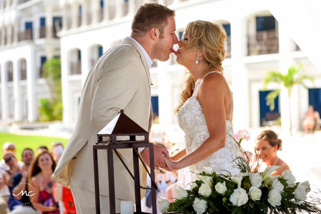 Bride and groom first kiss. The Royal Playa del Carmen Wedding. Martina Campolo Photography