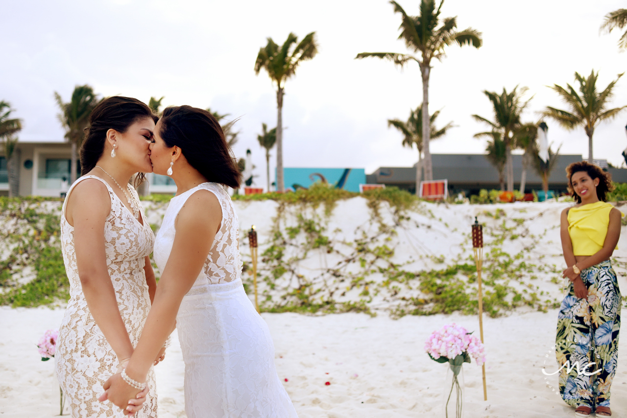 Brides kiss. Gay destination wedding at Andaz Mayakoba. Martina Campolo Photography