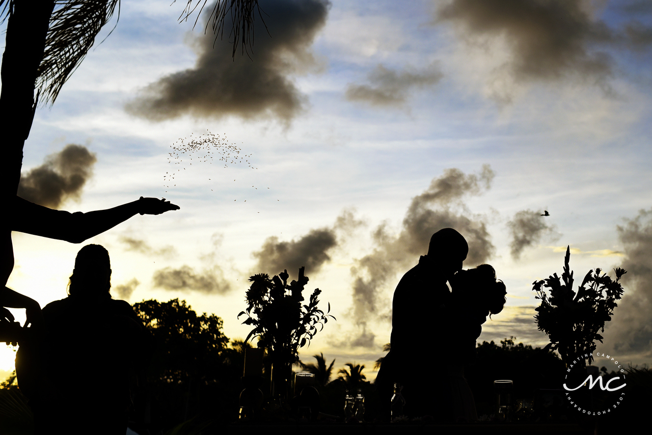 Bride and groom kiss, beautiful silhouettes by Martina Campolo Riviera Maya Photography