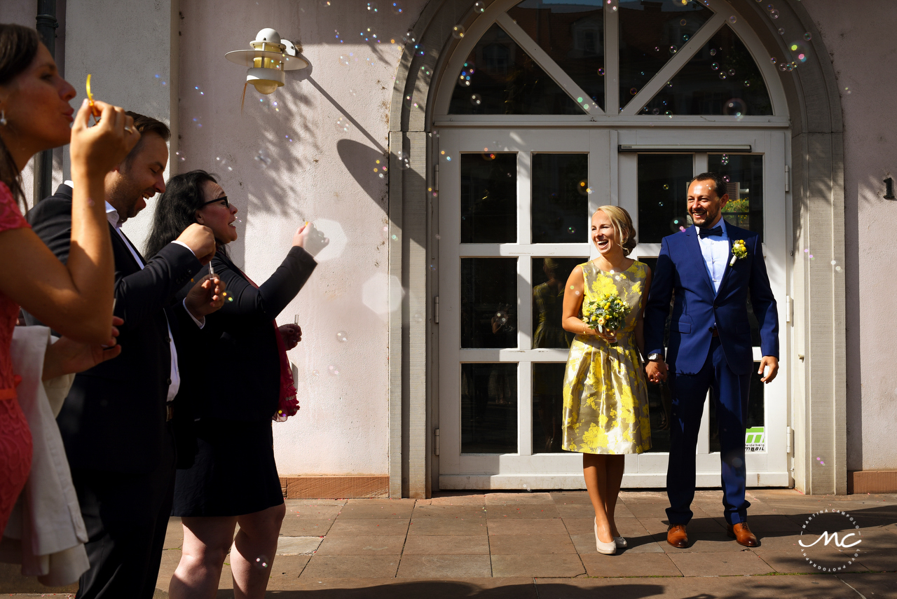 Bride and groom exit with bubbles. German Wedding in Heidelberg. Martina Campolo Photography