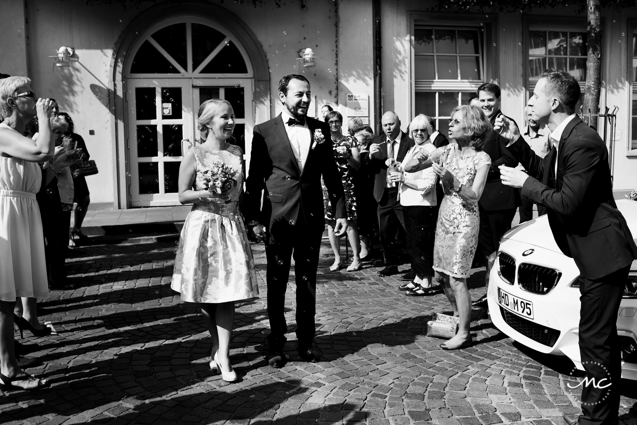 Bride and groom exit. Intimate German Wedding in Heidelberg. Martina Campolo Photography