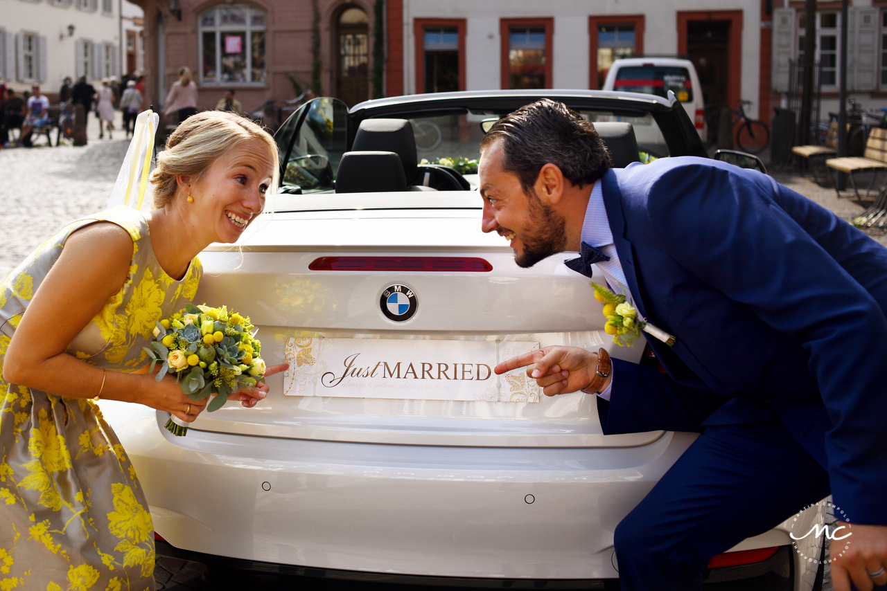 Bride and groom with Just Married Car. Heidelberg Wedding in Germany. Martina Campolo Photography