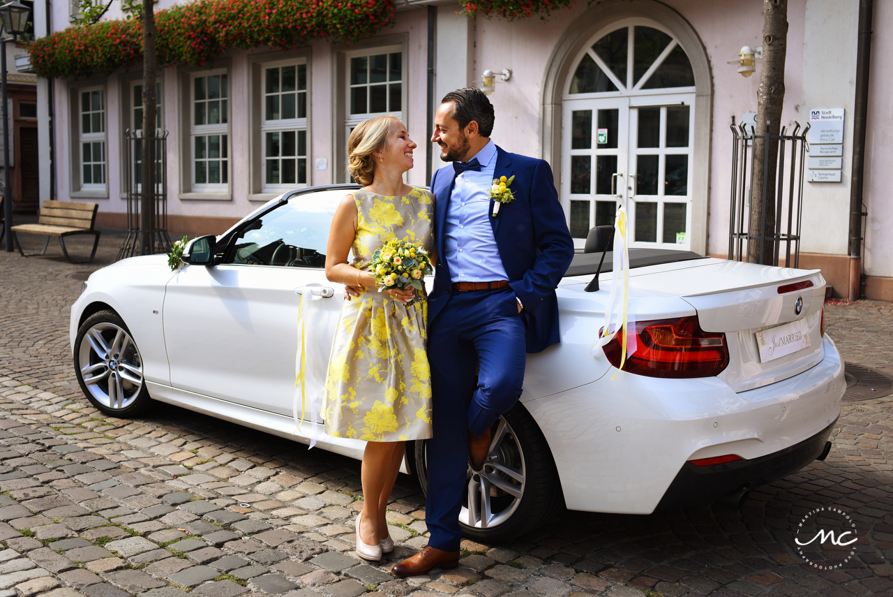 Newlyweds with Just Married Car. German Wedding in Heidelberg. Martina Campolo Photography