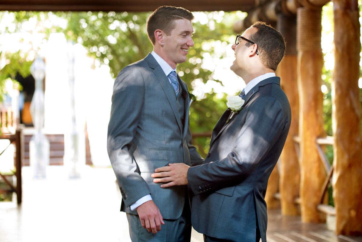 Groom and groom fun portraits at Paradisus Playa del Carmen, Mexico by Martina Campolo Photography