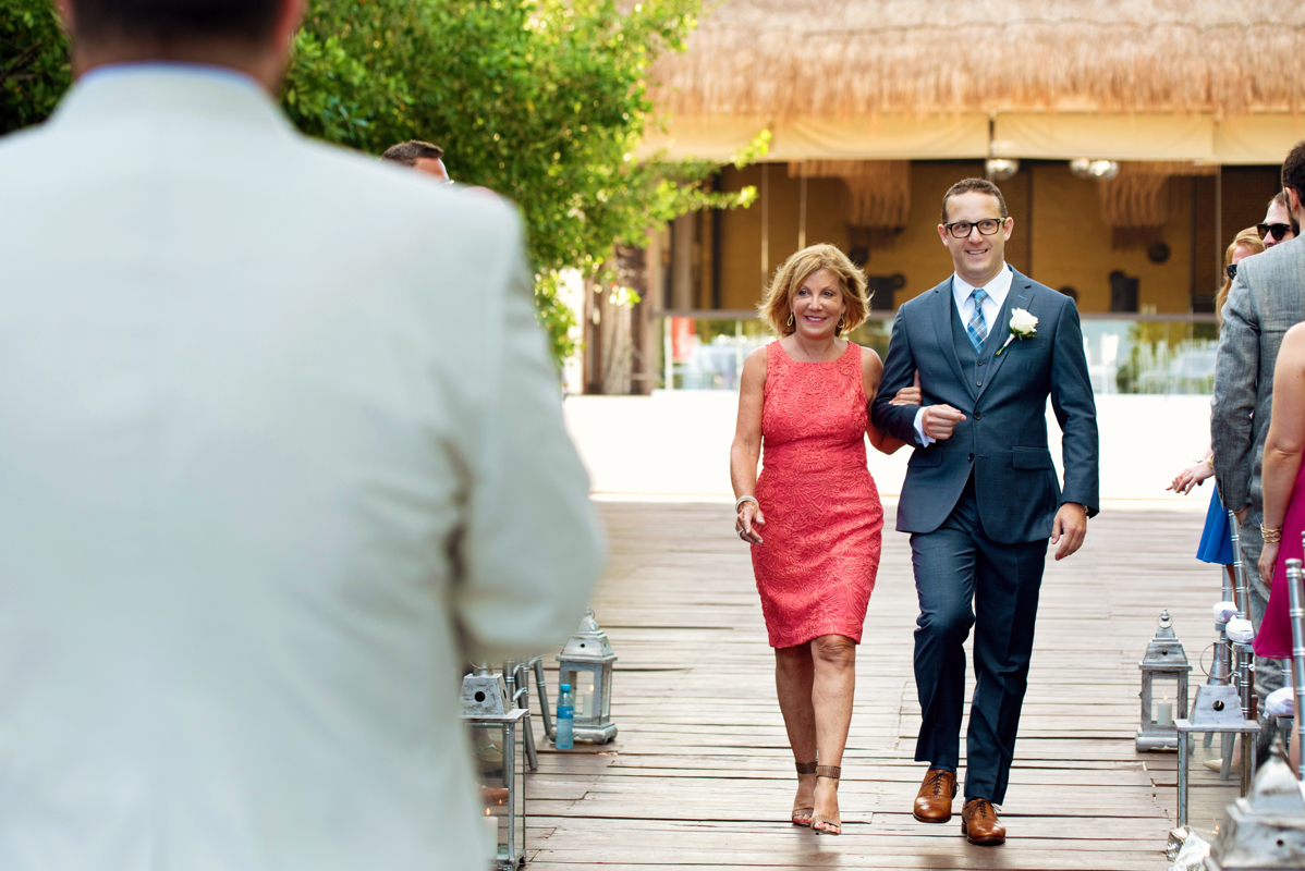 Groom entrance. Gay destination wedding at Paradisus Playa del Carmen by Martina Campolo Photography in Mexico