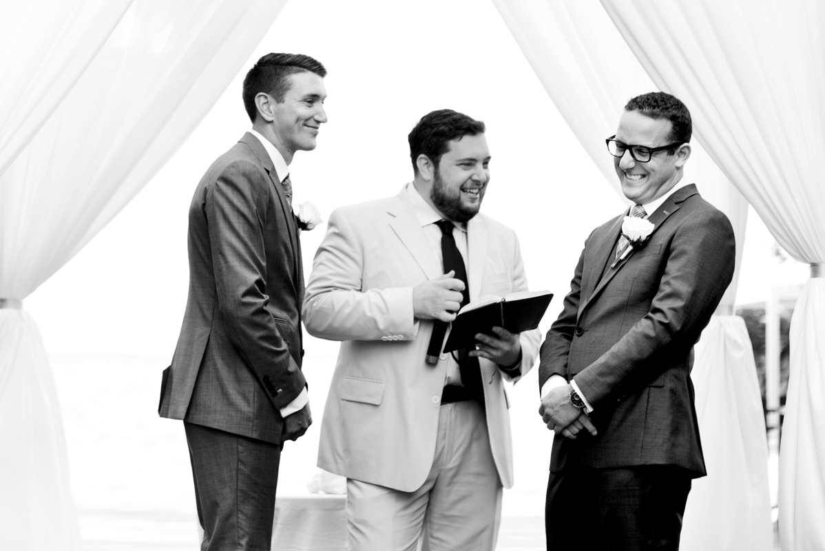 Happy grooms during wedding ceremony in Playa del Carmen, Mexico. Martina Campolo LGBT Wedding Photography