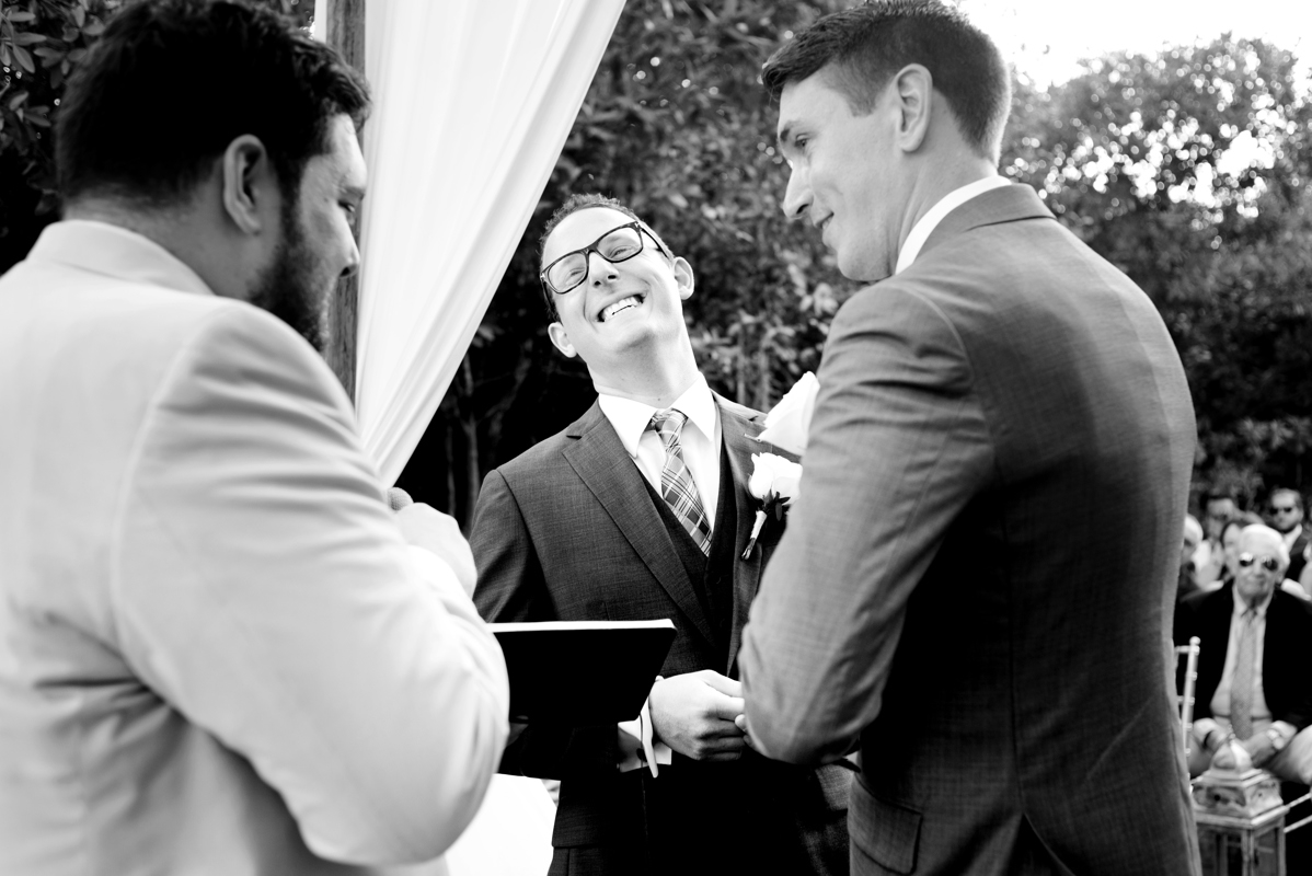 Black and white gay wedding ceremony moment by Martina Campolo Photography in Playa del Carmen, Mexico