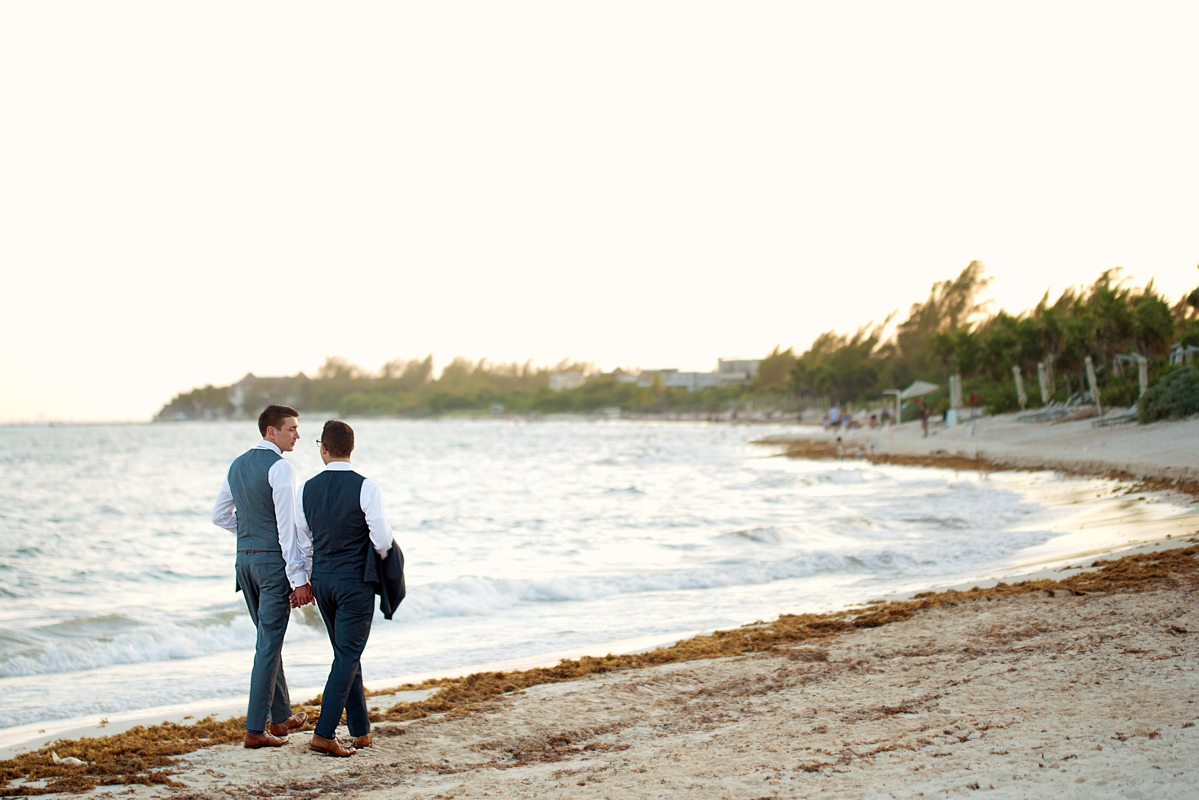 Groom and groom beach portraits in Playa del Carmen, Mexico by Martina Campolo Destination Wedding Photography