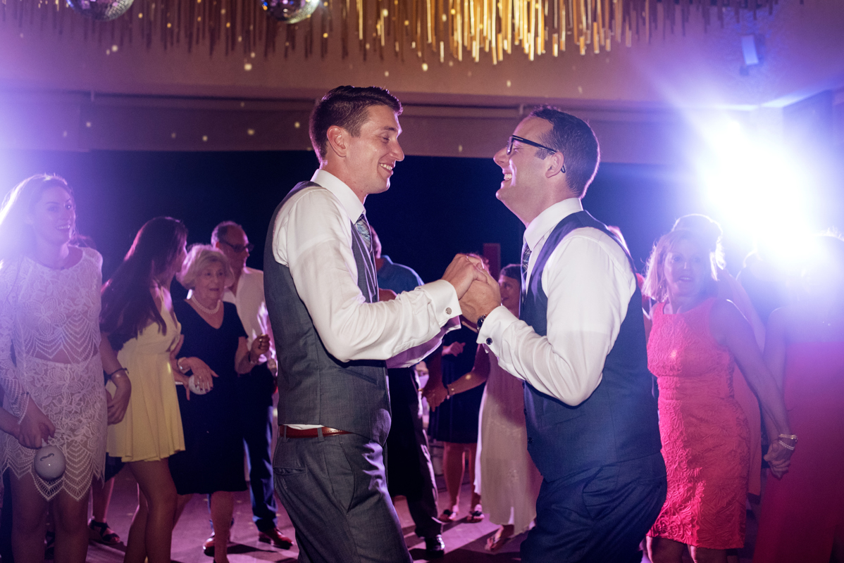 Groom and groom dance at Paradisus Playa del Carmen Jewish LGBT Wedding in Mexico. Martina Campolo Photography