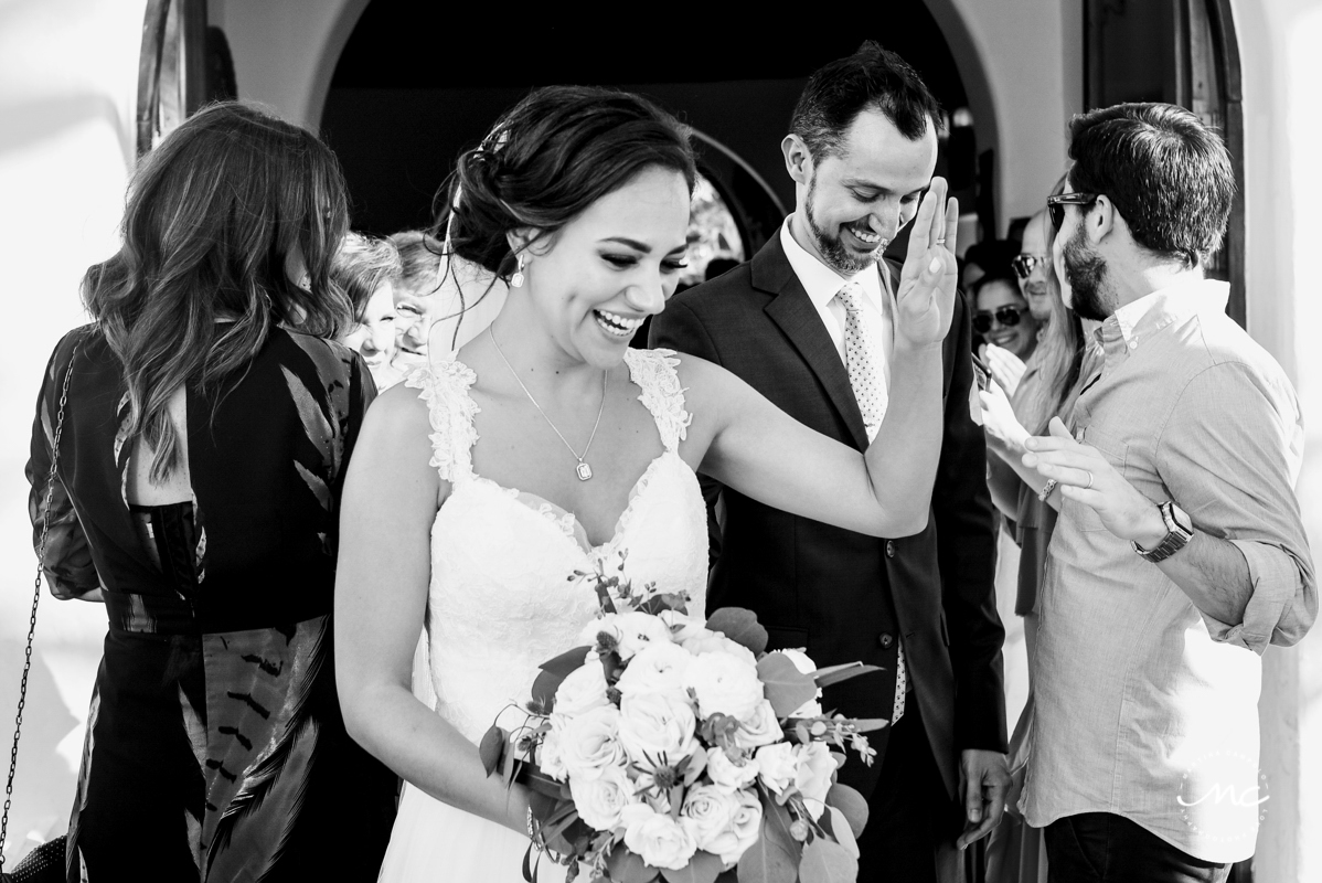 Bride and groom exit wedding chapel on 5th Ave in Playa del Carmen. Martina Campolo Photography