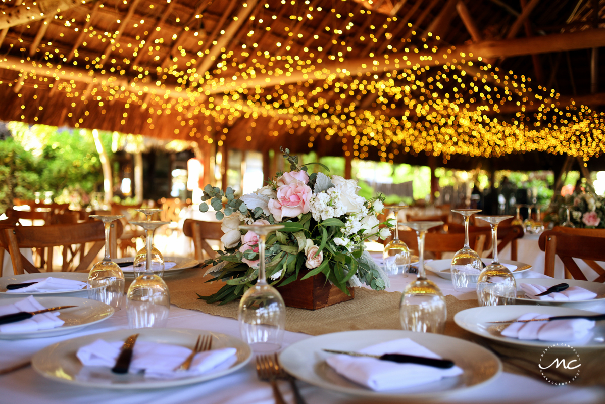 Rustic wedding reception decor with string lights at Blue Venado, Playa del Carmen. Martina Campolo Photography