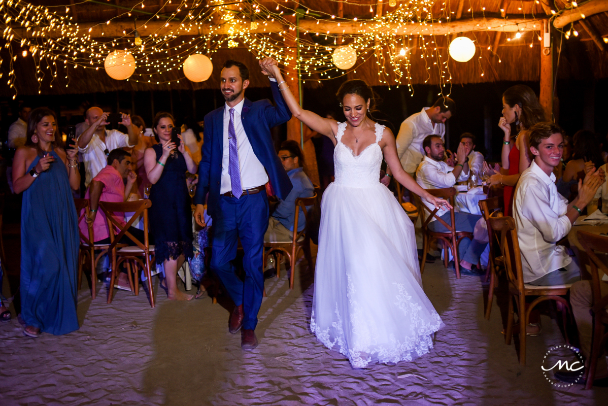 Bride and groom reception entrance at Blue Venado Beach Club in Mexico by Martina Campolo Photography