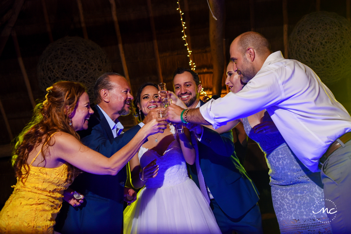 Cheers. Wedding Reception moment at Blue Venado Beach in Mexico. Martina Campolo Photography