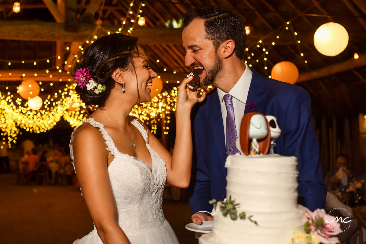 Cake cutting moment at Blue Venado Beach Wedding in Mexico. Martina Campolo Photography