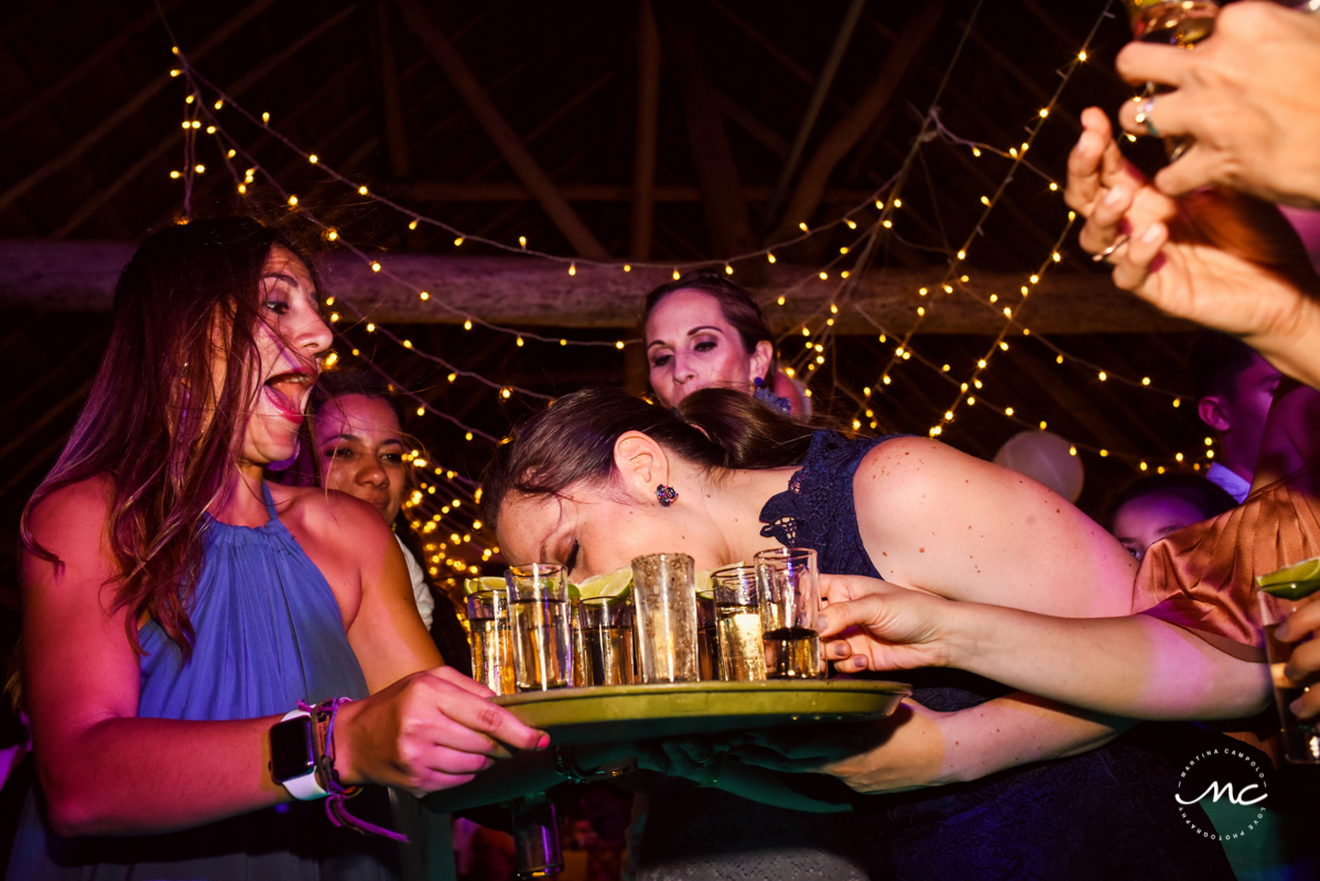 Drinking tequila shots at Blue Venado Wedding in Mexico. Martina Campolo Photography
