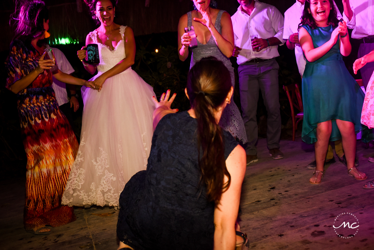 Wedding guests dance at Blue Venado Beach Wedding in Mexico. Martina Campolo Photography