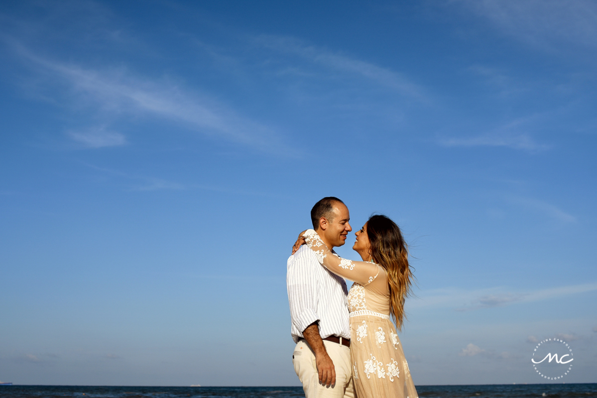 Couple embraces in a hug. Playacar engagement session by Martina Campolo Photography in Mexico