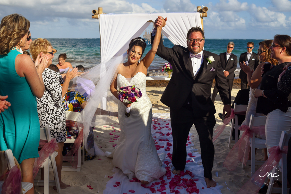 Bride and groom exit by Martina Campolo Now Sapphire Riviera Cancun Wedding Photography