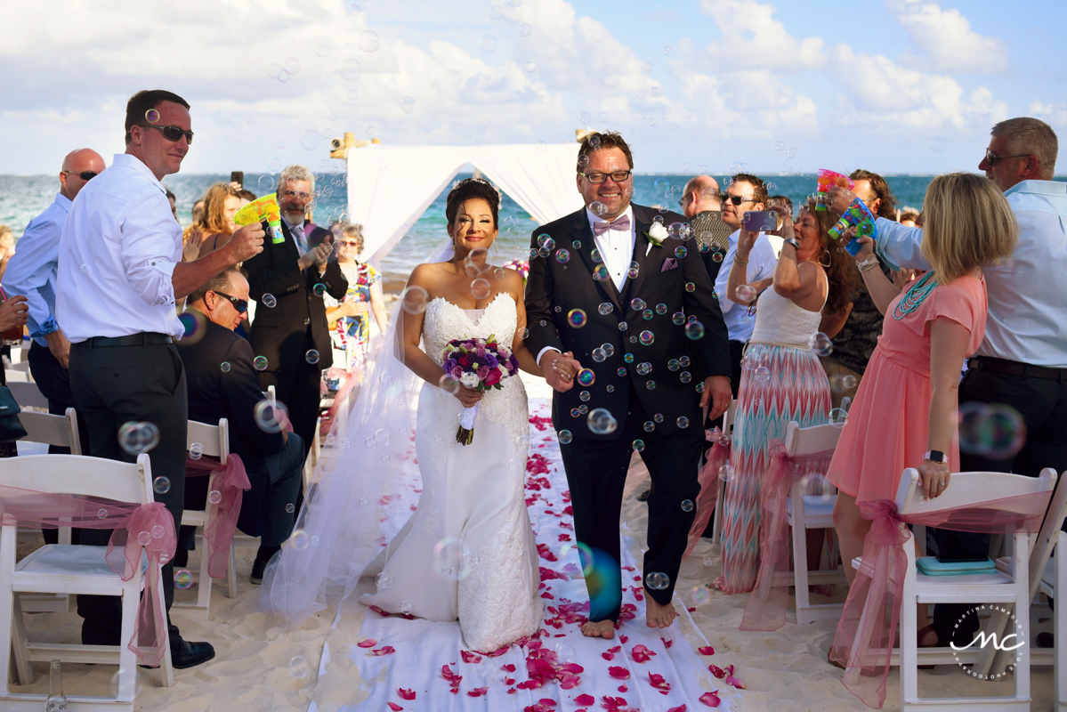 Bride and groom exit with bubbles by Martina Campolo Now Sapphire Wedding Photographer