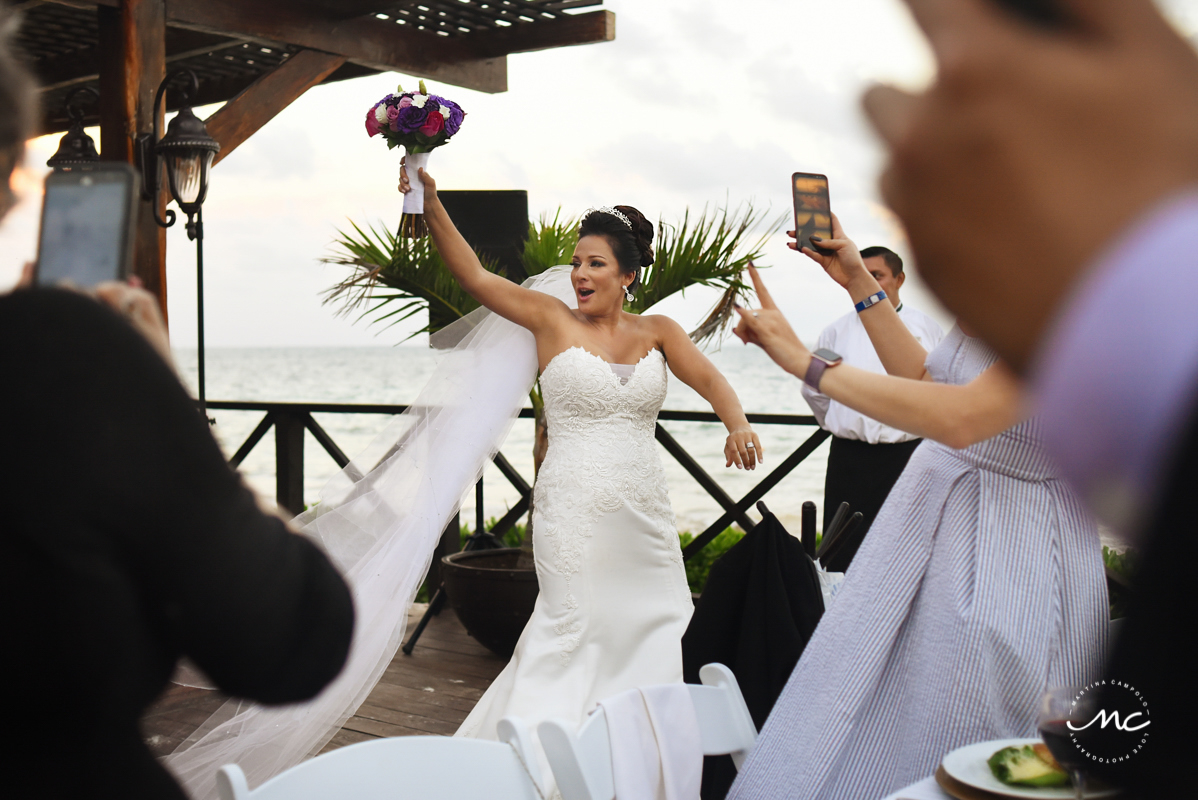 Happy bride enters wedding reception site at Now Sapphire Riviera Cancun. Martina Campolo Photography