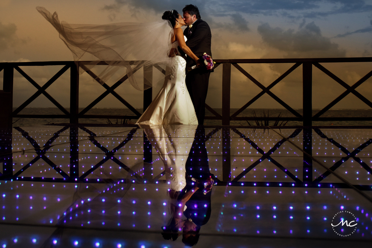 Bride and groom sunset portraits on dance floor. Now Sapphire Riviera Cancun, Mexico. Martina Campolo Wedding Photography