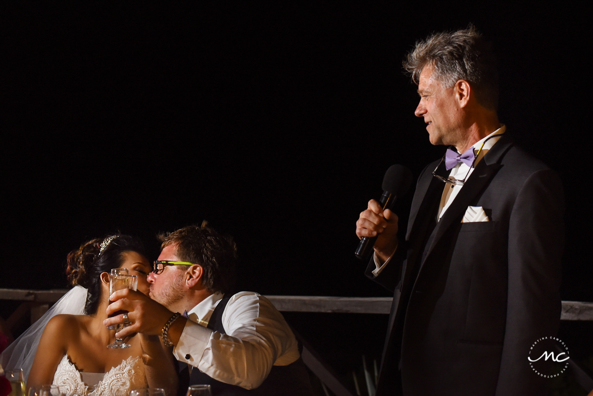 Bride and groom kiss at wedding reception in Now Sapphire, Mexico. Martina Campolo Photography