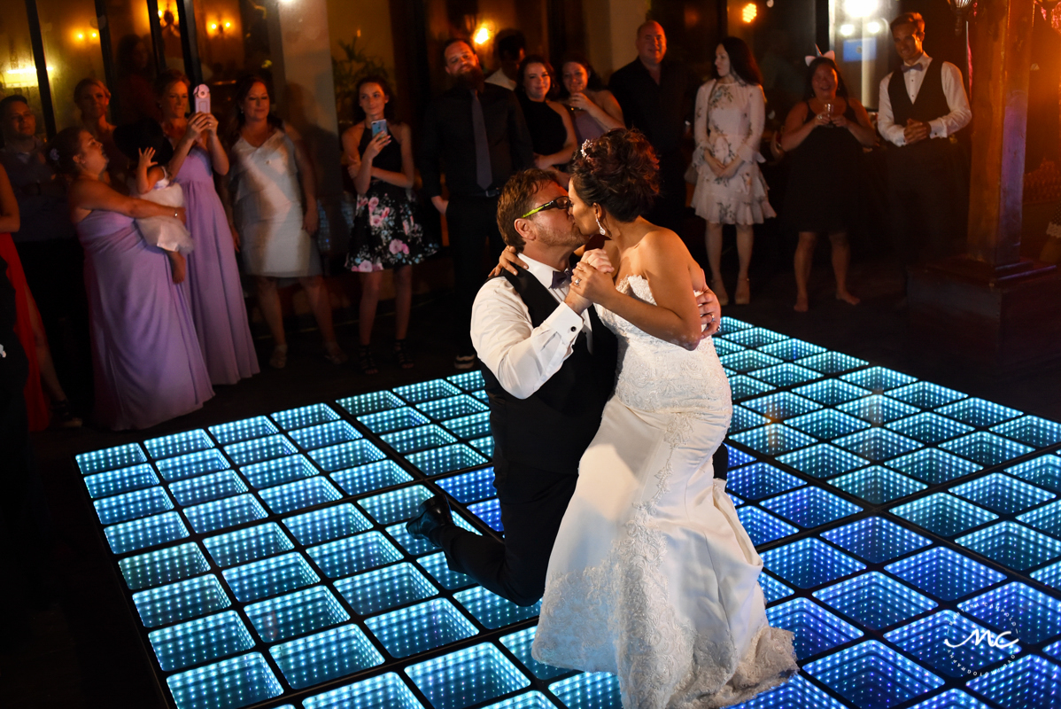 Bride and groom dance on infinity dance floor. Now Sapphire Riviera Cancun wedding by Martina Campolo Photography