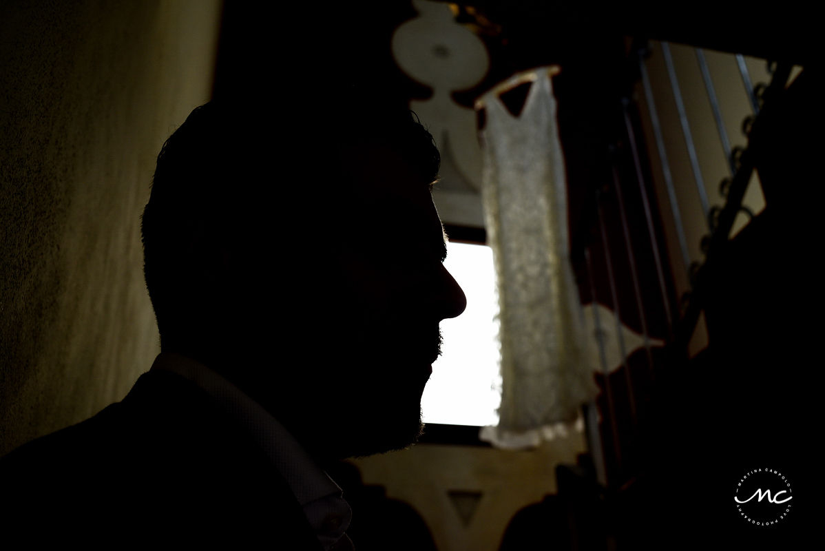 Groom portrait with wedding dress at Hacienda del Mar, Riviera Maya, Mexico. Martina Campolo Photography