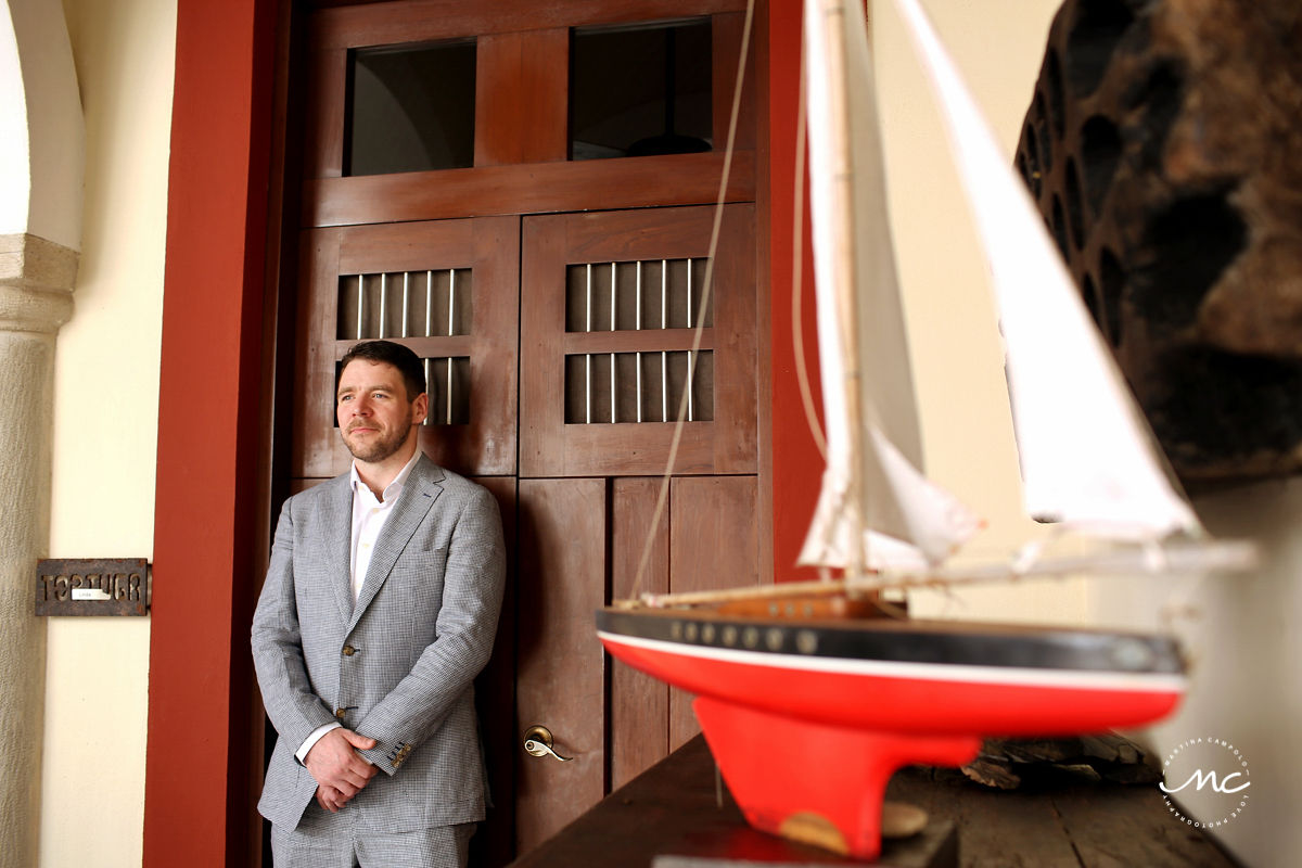 Groom portraits with rustic wooden door at Hacienda del Mar, Riviera Maya, Mexico. Martina Campolo Wedding Photography