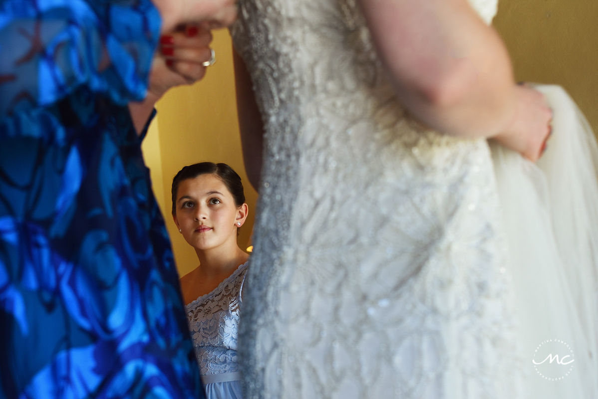 Girl watching bride getting dressed. Hacienda del Mar destination wedding in Mexico by Martina Campolo Photography