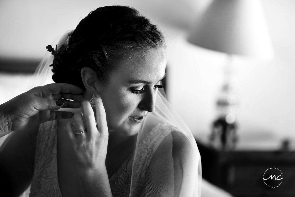 Bride placing her earrings. Hacienda del Mar destination wedding in Mexico by Martina Campolo Photography