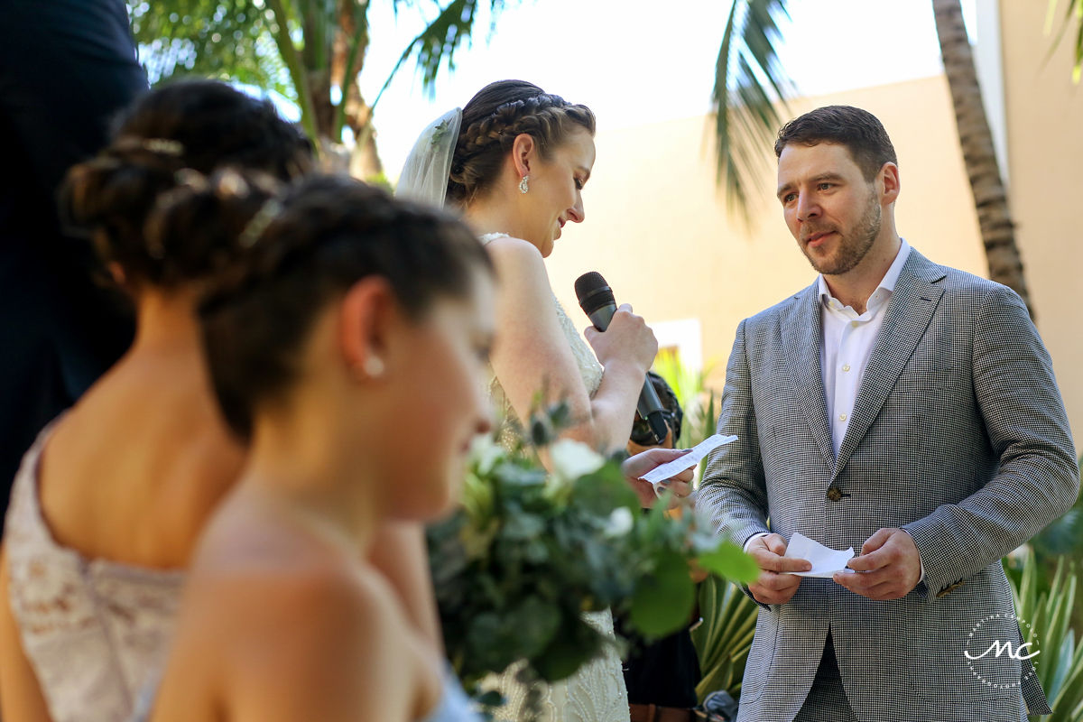 Bride reading wedding vows at Hacienda del Mar, Puerto Aventuras, Mexico. Martina Campolo Photography