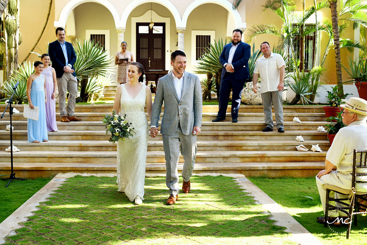 Bride and groom exit garden wedding at Hacienda del Mar, Riviera Maya, Mexico. Martina Campolo Photography