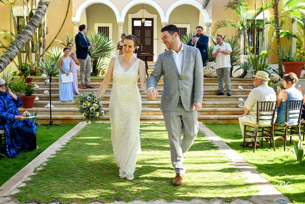 Bride and groom ceremony exit. Hacienda del Mar destination wedding in Puerto Aventuras, Mexico. Martina Campolo Photography