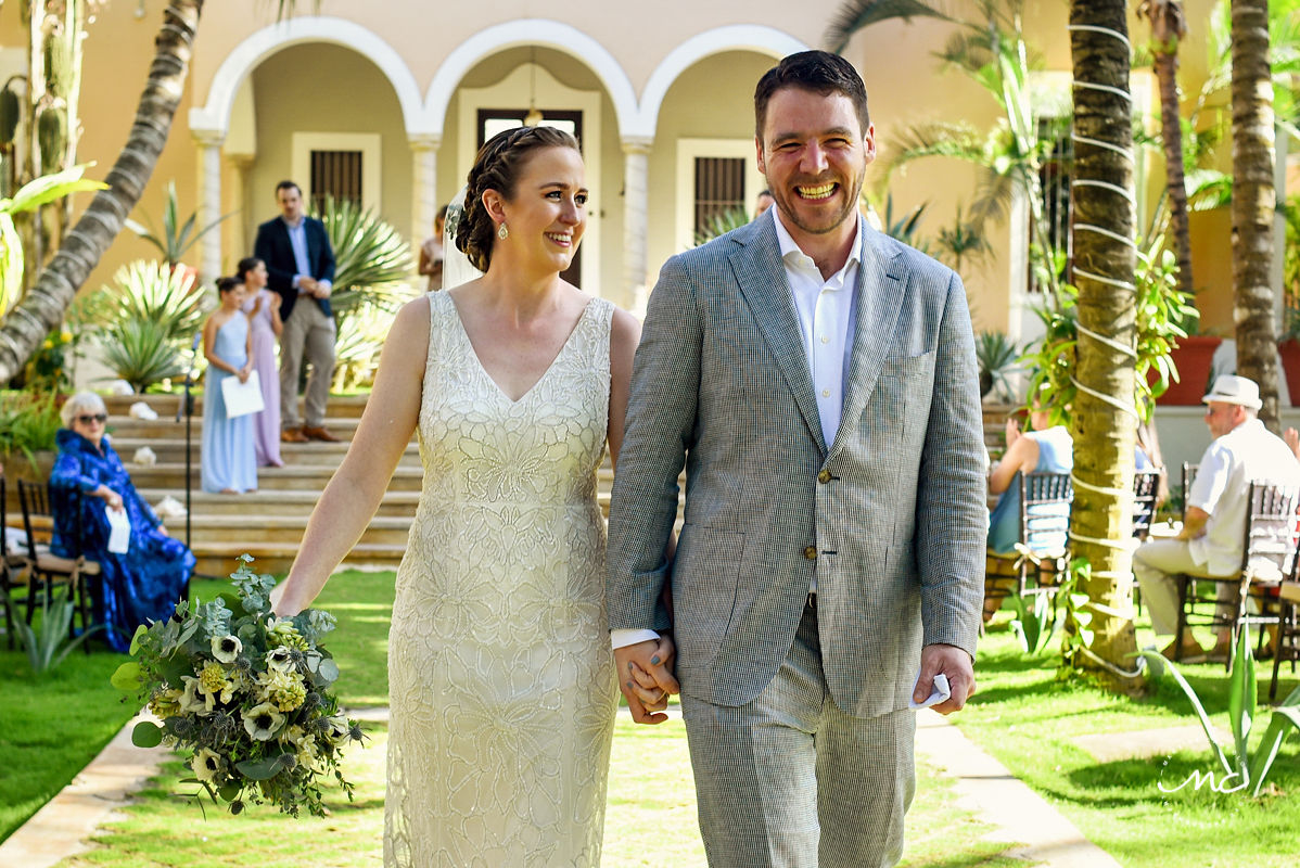 Bride and groom exit. Hacienda del Mar garden wedding in Riviera Maya, Mexico. Martina Campolo Photography