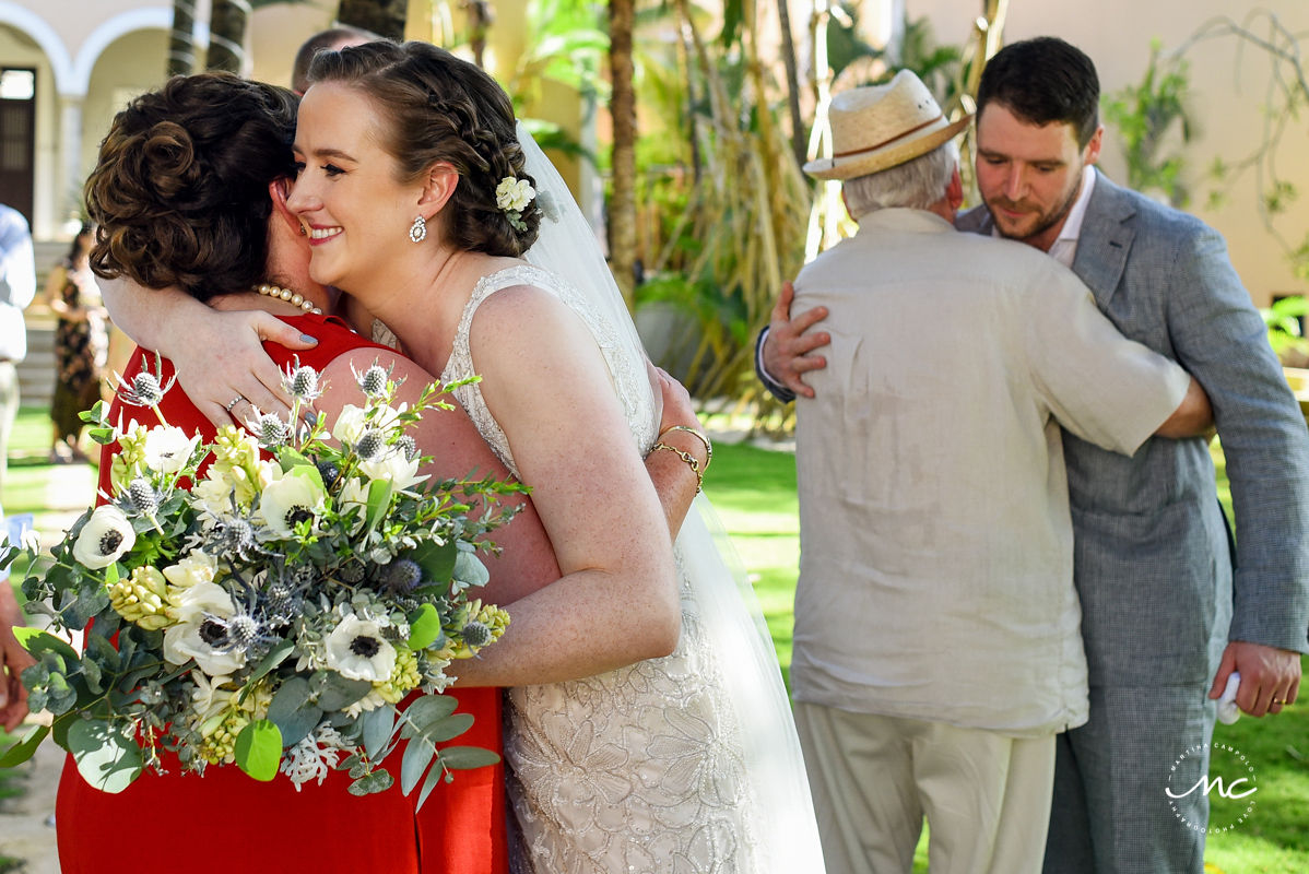 Bride and groom hug guests at Hacienda del Mar wedding in Mexico by Martina Campolo Photography