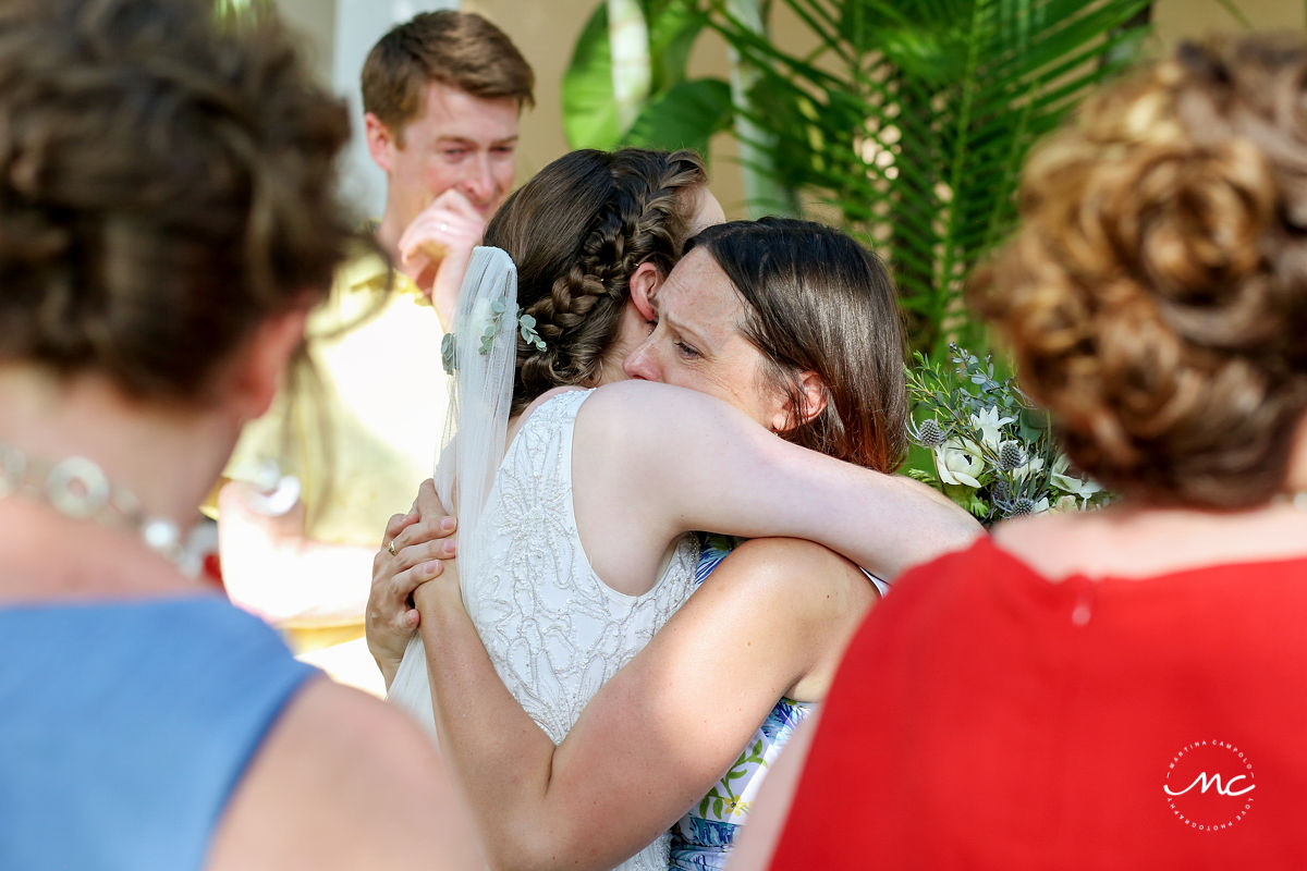 Wedding guests hug bride. Hacienda del Mar destination wedding in Mexico by Martina Campolo Photography