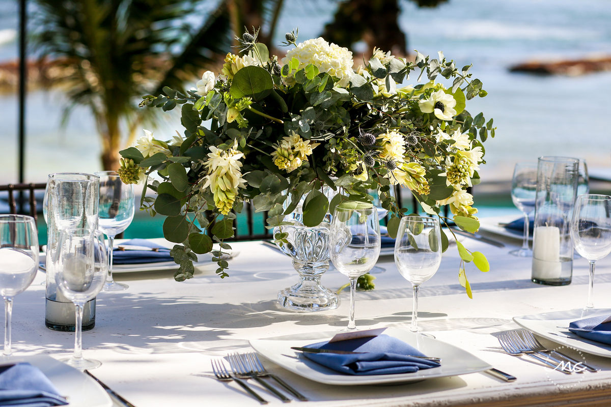 White and green floral centerpiece with clear vase at Hacienda del Mar Wedding in Mexico. Martina Campolo Photography