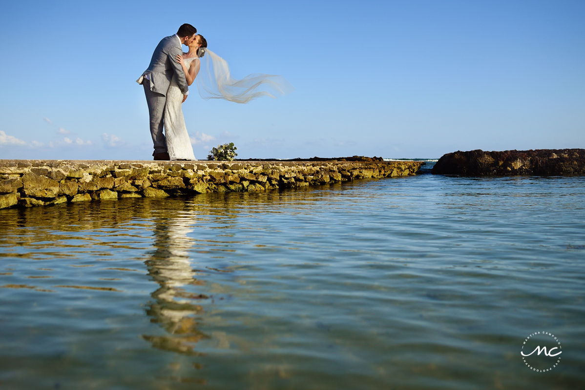 Bride and groom portraits with flying veil on a pier. Hacienda del Mar Wedding in Riviera Maya, Mexico. Martina Campolo Photography