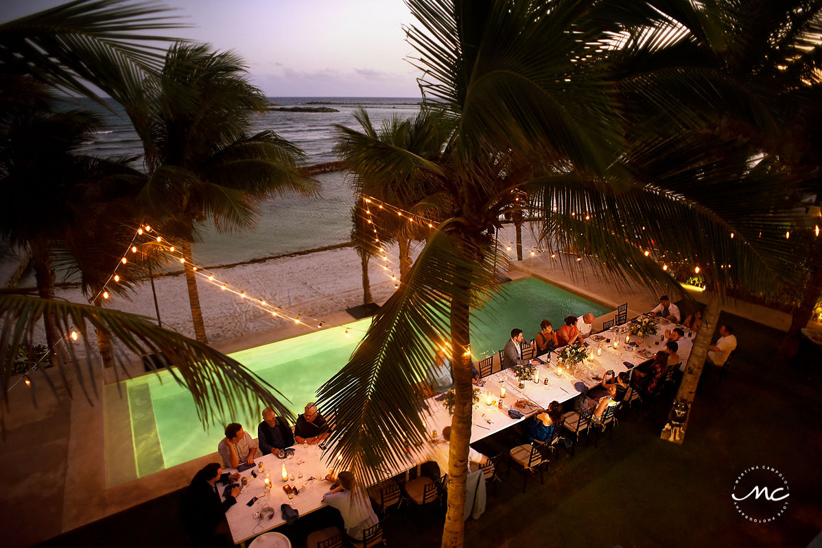 Aerial view of Hacienda del Mar poolside wedding reception with bistro lights in Mexico. Martina Campolo Photography