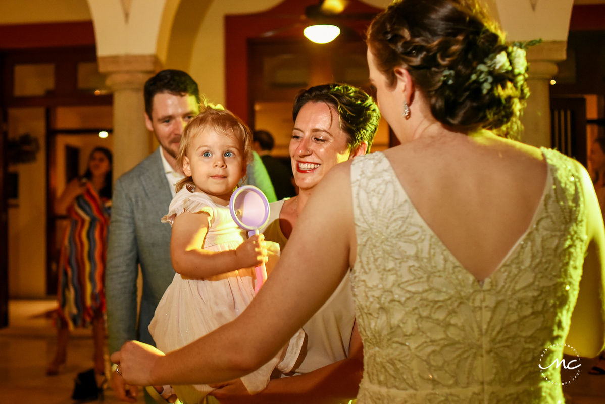 Baby girl having fun at wedding reception. Hacienda del Mar, Puerto Aventuras, Mexico. Martina Campolo Photography