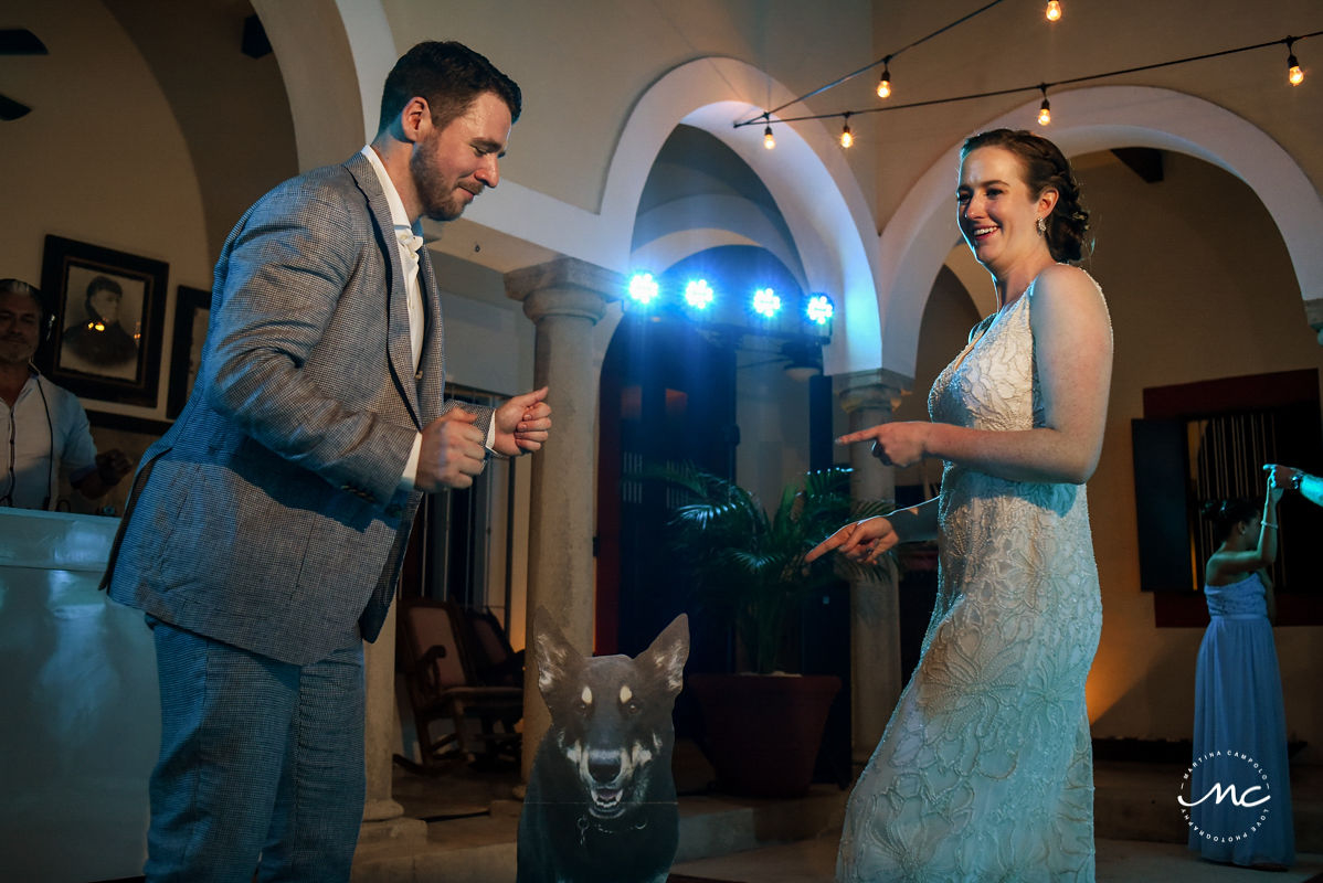 Bride and groom dance with cutout image of their dog at Hacienda del Mar Wedding in Mexico. Martina Campolo Photography