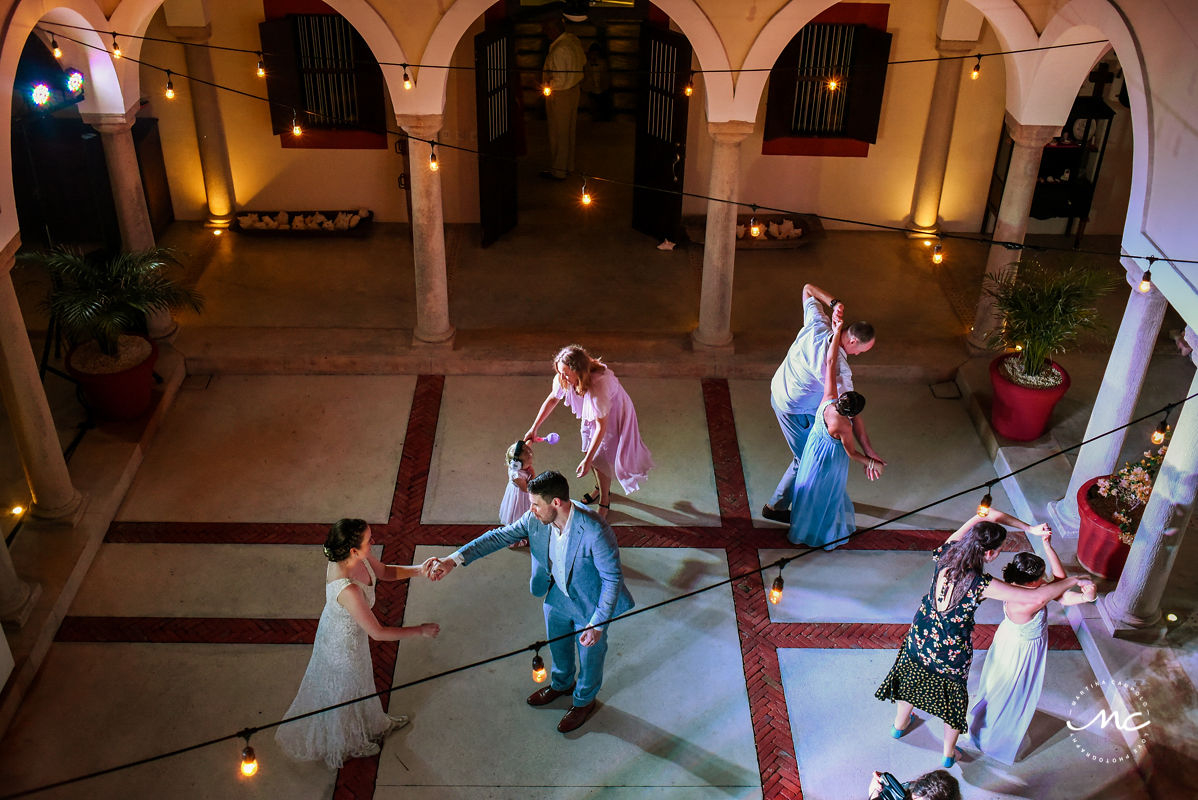 Wedding guests dance at Hacienda del Mar wedding reception in Mexico. Martina Campolo Photography